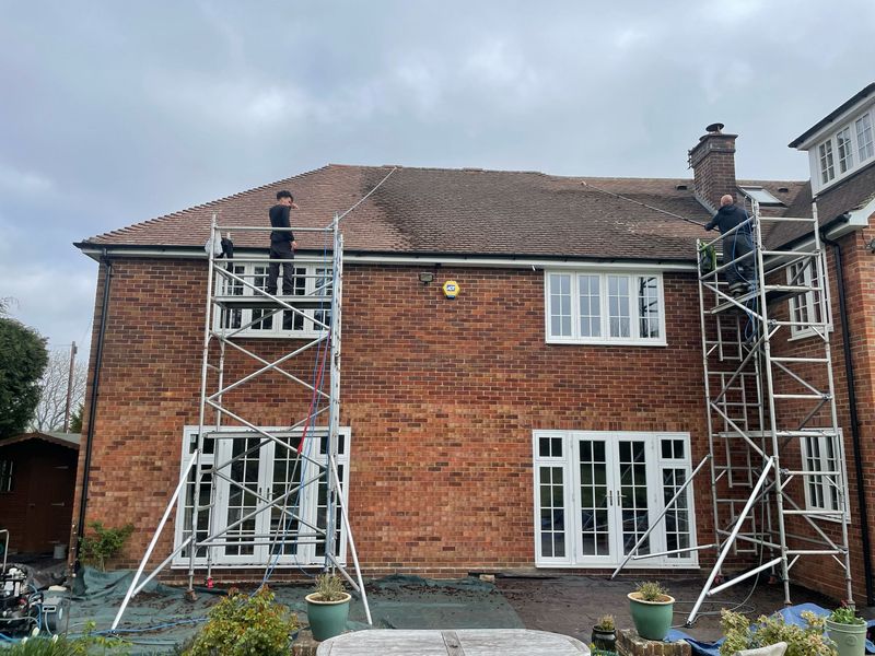 Roof cleaning carried out safely from scaffold towers by The Roof Moss Cleaners in Romsey
